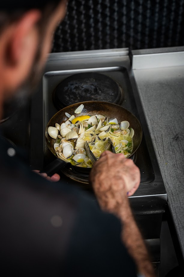 Chef preparing clams