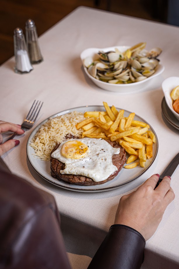 Steak with egg, rice and fries